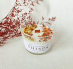 Vela aromática Chispa con canela, naranja seca y piedra cornalina para despertar los sentidos.