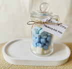 Cera aromática en forma de corazones azules y blancos con fragancia fresca.